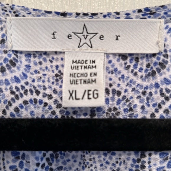 Sleeveless v neck with pretty white, and shades of blue in a pretty pattern - Picture 2 of 3